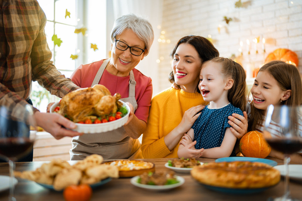 family gathered around to enjoy a Thanksgiving feast.
