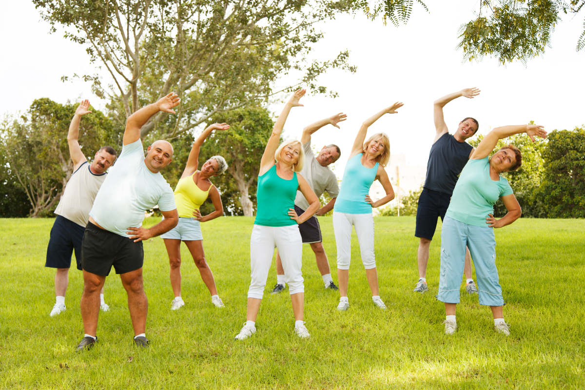 older men and women stretching outside