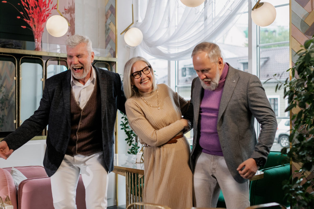 group of older people laughing and having a good time