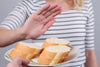 close-up of woman using her hand to say 