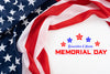 US flag in upper left corner, wrapped around the words 
