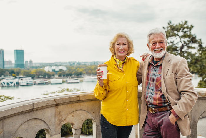 senior couple traveling and smiling.