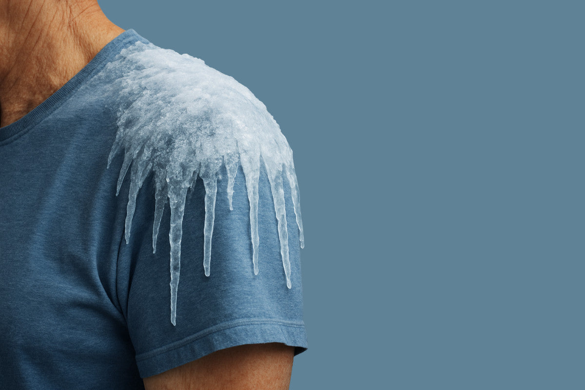 Close-up of older man's shoulder with icicles on it.