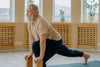 senior man stretching on a yoga mat