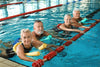 4 seniors swimming in a lap pool
