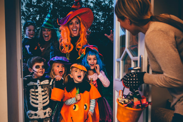kids and adults trick-or-treating.