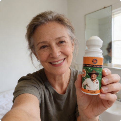 Smiling Outback customer holding her Original Oil roll-on